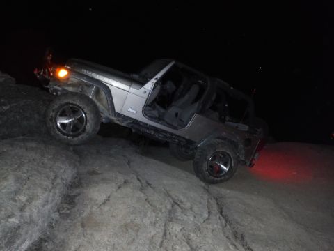 2005 Jeep Wrangler - Silver 2005 Jeep Wrangler Rubicon navigates rocky terrain in the dark.