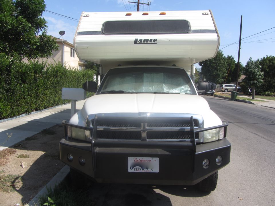 1997 Dodge 3500 pickup truck with a Lance camper shell, front view