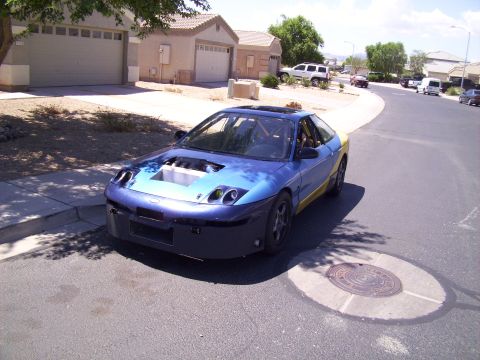 1995 Ford Probe - This modified 1995 Ford Probe features a custom paint job and an open engine compartment.