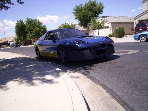 1995 Ford Probe - This 1995 Ford Probe appears to be modified for racing, with a visible roll cage and a removed front bumper.