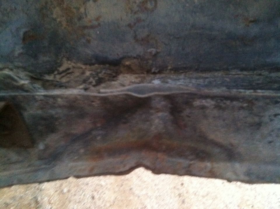 Subframe of a vehicle, showing rust and wear