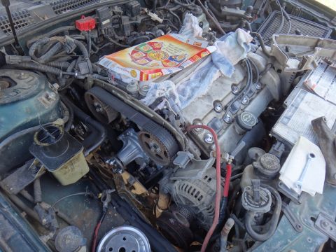 1995 Ford Taurus - Engine bay components including timing belt, water pump, and alternator are visible.