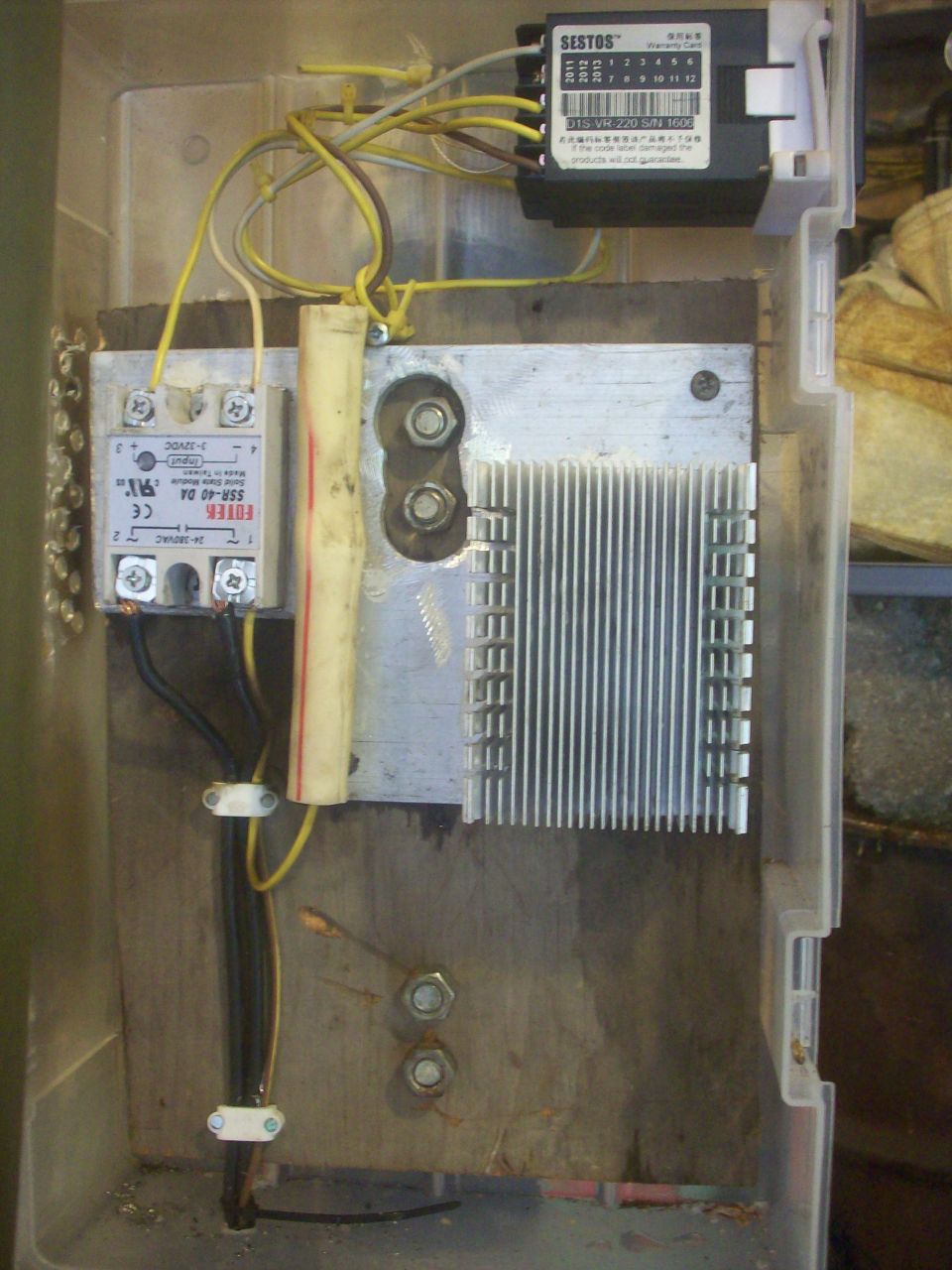 After burning my first SSR (Solid Stae Relay) out due to a lack of a heat sink, the new SSR has one now!