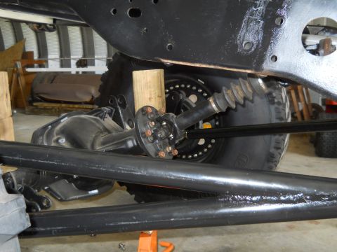 1992 Ford Bronco - Close-up view of the undercarriage and suspension components of a vehicle.