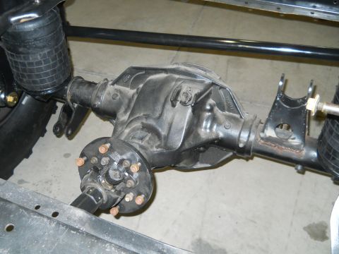1992 Ford Bronco - Close-up of a vehicle's rear axle and suspension system.