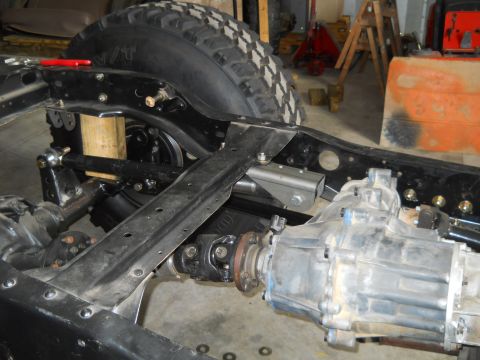 1992 Ford Bronco - Undercarriage view showing the frame, suspension, and drivetrain components of a vehicle during maintenance or modification.