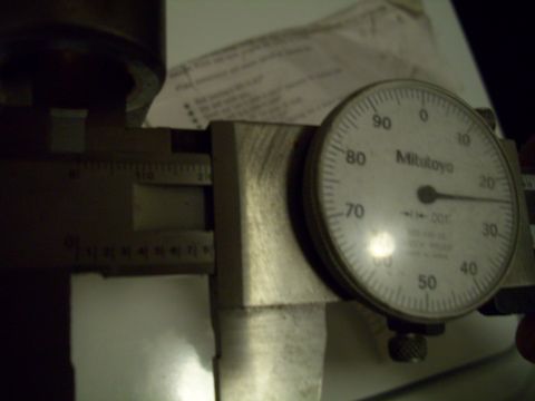 1995 Ford Probe - A close-up of a Mitutoyo dial indicator and caliper, suggesting a mechanical measurement is being taken.