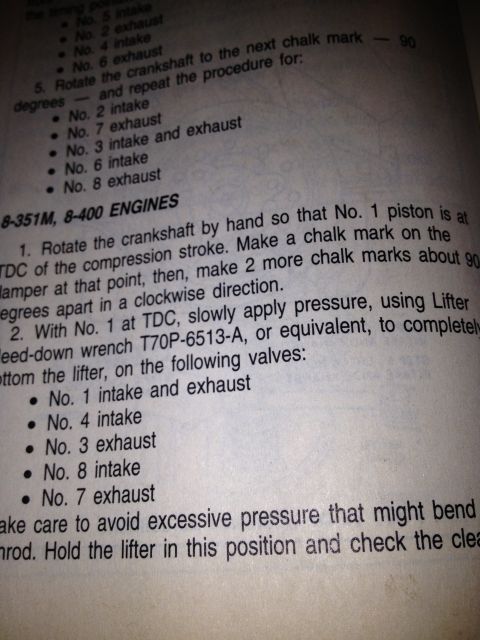 1979 Ford Bronco - Extreme close-up of a shop-manual page describing valve lash / lifter bleed-down procedure for 8-351M and 8-400 engines, instructing the re…