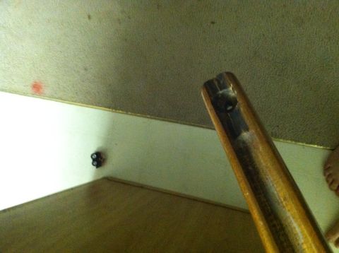 1989 Ford Bronco - Close-up of a wooden gun stock, showing the channel for the metal receiver.