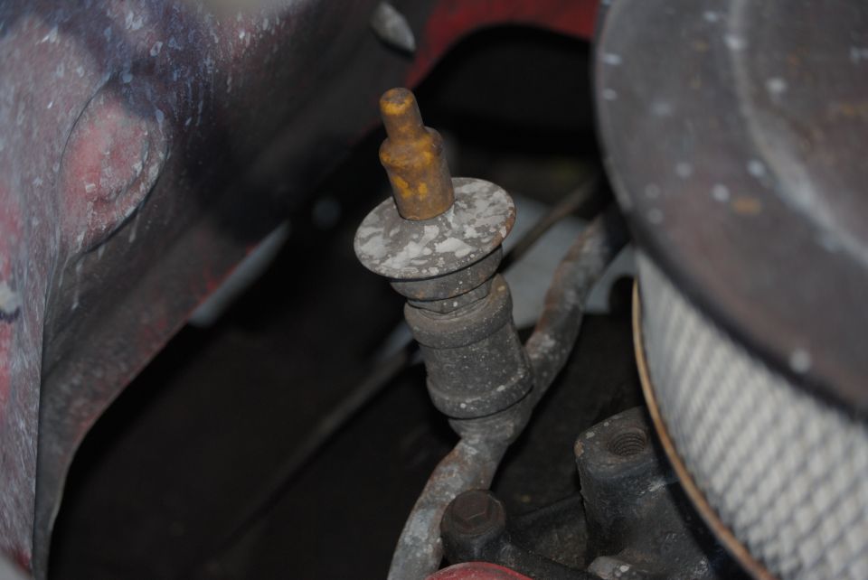 Engine component with yellow cap and metal tubing