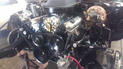 1972 Pontiac Trans Am - Close-up of a Pontiac V8 engine, showing the alternator, belts, and brake booster assembly.