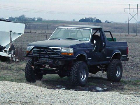 1992 Ford Bronco - This lifted 1992 Ford Bronco features a custom brush guard and winch, ready for off-road adventures.
