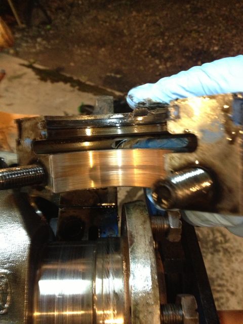 1989 Ford Bronco - Close-up of a worn engine bearing, indicating potential mechanical issues.