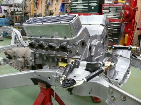 1976 Chevrolet Corvette - Engine and chassis components are assembled on a stand in a workshop setting.