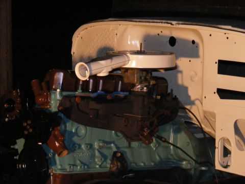 Engine bay with V8 engine, carburetor, and air cleaner