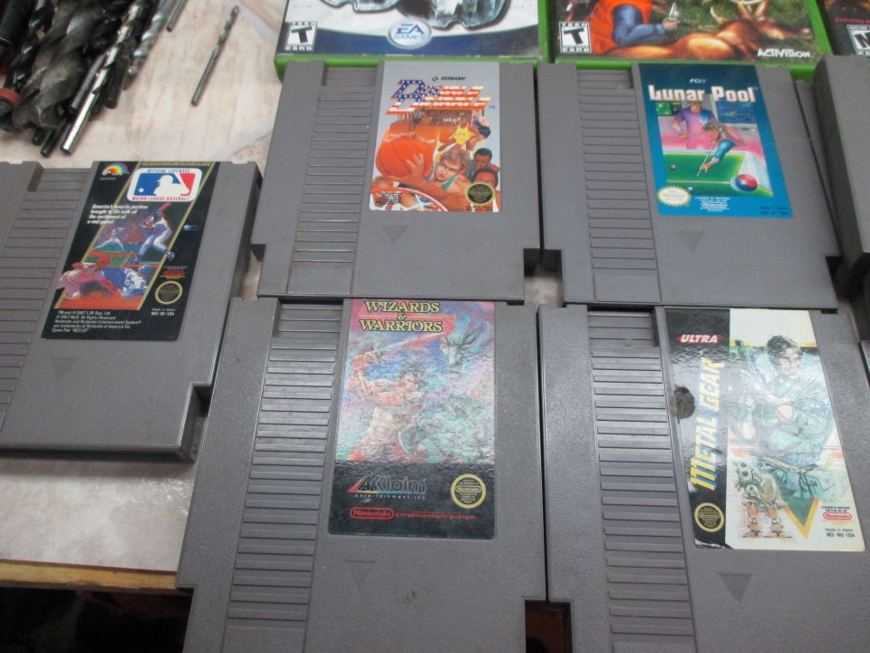 NES video game cartridges including Metal Gear and Wizards & Warriors