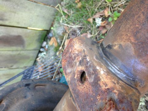 1992 Ford F-150 - I wire wheeled the welds on the spring perches to see if they were bad. They look godd, but they still might need to be repaired or removed.