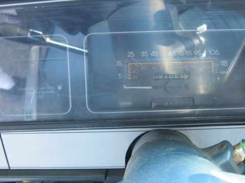 2001 Ford Crown Victoria - The car's interior displays a dashboard with a fuel gauge and a speedometer reading 091053 miles.