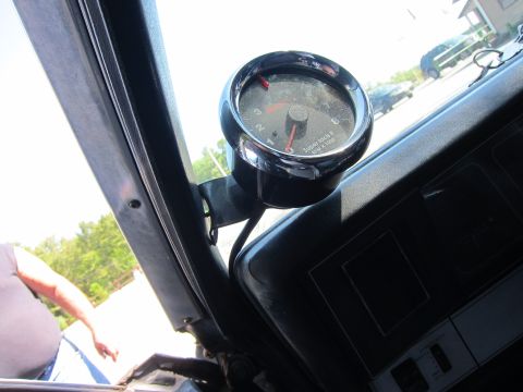 2001 Ford Crown Victoria - A tachometer is mounted on the dashboard, showing RPMs up to 8000.