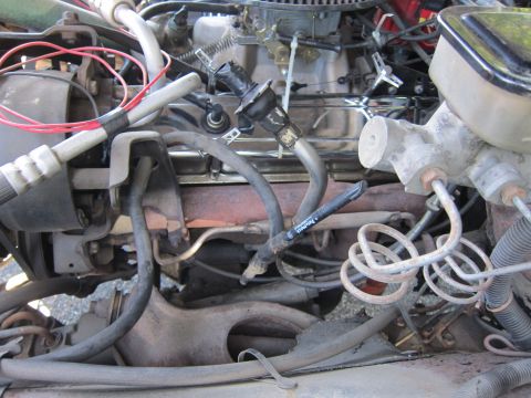 2001 Ford Crown Victoria - Close-up of an engine bay, focusing on the brake master cylinder and associated plumbing.