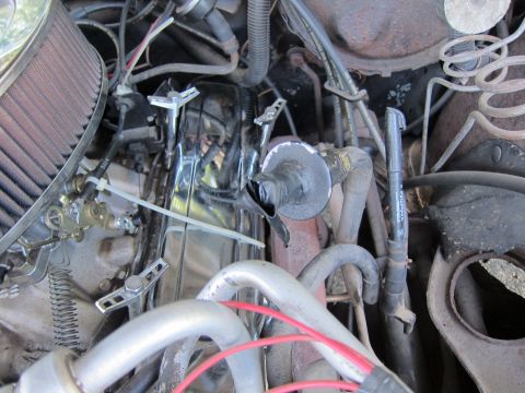 2001 Ford Crown Victoria - Close-up view of an engine bay, showing chrome valve covers, an air filter, and various hoses and wires.