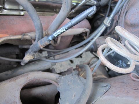 2001 Ford Crown Victoria - A marker labeled '• PullaMARK' rests on a spark plug wire within a cluttered engine bay.