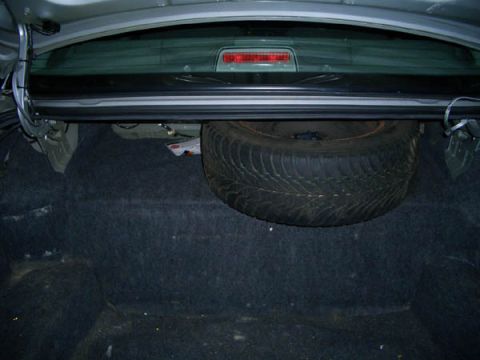 1999 Ford Crown Victoria - Inside view of the trunk, note the full size ultragrip spare! Haven't vacuumed or cleaned the trunk, it should clean up well