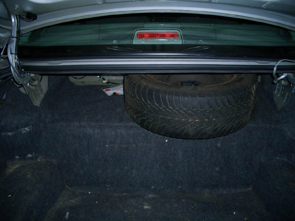 Inside view of the trunk, note the full size ultragrip spare! Haven't vacuumed or cleaned the trunk, it should clean up well