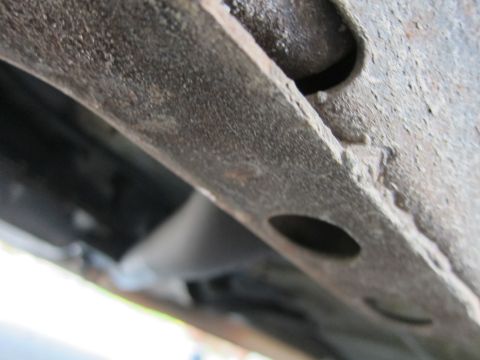 2001 Ford Crown Victoria - Undercarriage view showing a section of the vehicle's frame and exhaust system.