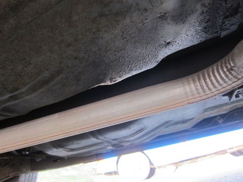 2001 Ford Crown Victoria - Underside view of a vehicle, showing the exhaust system and fuel tank. No specific year or model identification is visible.