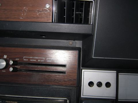 2001 Ford Crown Victoria - Close-up of a car's interior, showing climate control sliders and air vents.