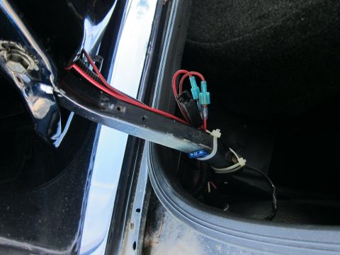 2001 Ford Crown Victoria - Photograph of real wiring and connectors in a car trunk, not a wiring diagram.