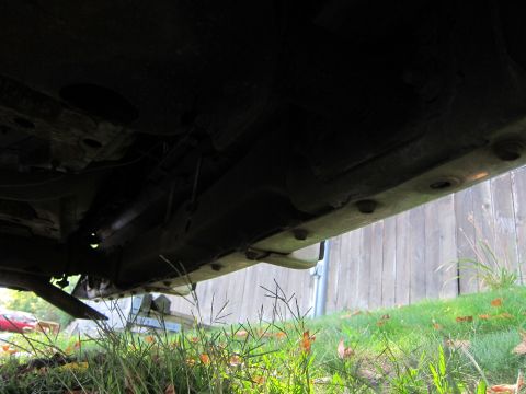 2001 Ford Crown Victoria - Photograph of a car's undercarriage frame, not a technical document.