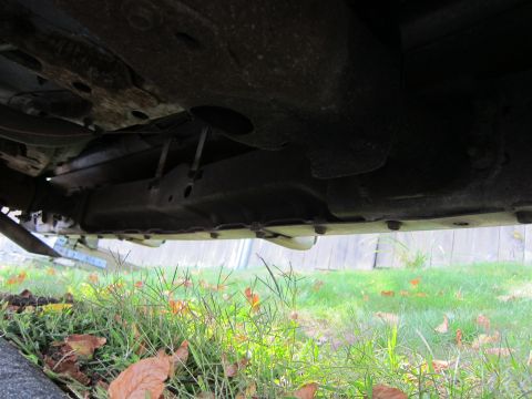 2001 Ford Crown Victoria - Photograph of a car's underbody, not a technical document.