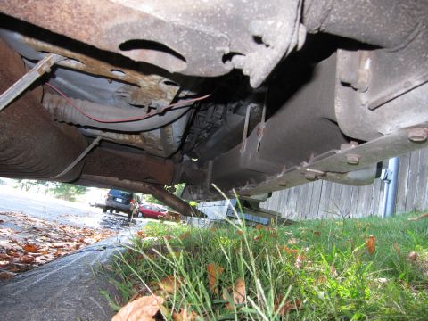 2001 Ford Crown Victoria - Photograph of a car's underbody, not a technical document.