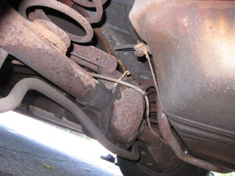 2001 Ford Crown Victoria - Close-up view of a vehicle's exhaust system components.
