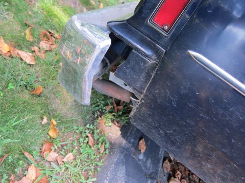 2001 Ford Crown Victoria - Photograph of a car's rear bumper, not a technical document.