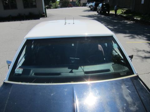 2001 Ford Crown Victoria - Interior view of a 2001 Ford Crown Victoria police car, showing the dashboard and roof.