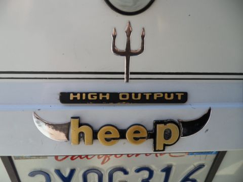 1973 Ford Ranchero - A custom emblem on the rear of a vehicle reads 'heep' with a trident and horns, alongside a 'HIGH OUTPUT' badge.