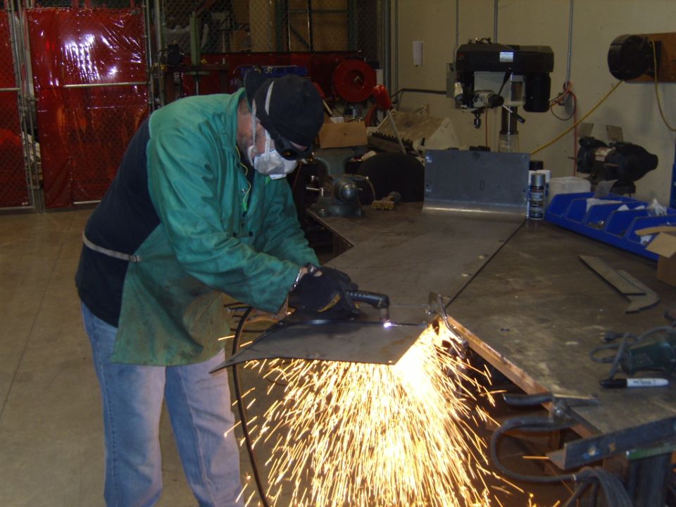 working on corner blanks,cutting out the wheel openings.