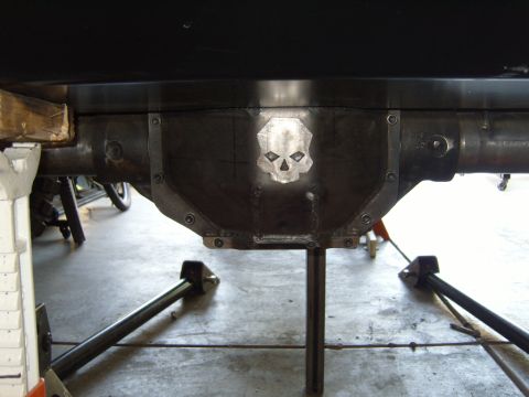 1985 Jeep CJ7 - Custom differential cover with skull emblem, likely for an off-road vehicle.
