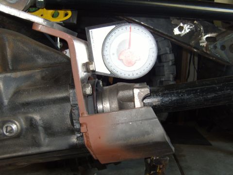 1985 Jeep CJ7 - A gauge is used to measure the angle of a vehicle's differential during a modification.