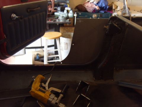 1985 Jeep CJ7 - Vehicle interior undergoing repairs with tools present.