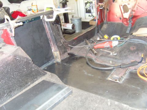 1985 Jeep CJ7 - The interior of a vehicle is shown with tools and repair materials, suggesting ongoing work.
