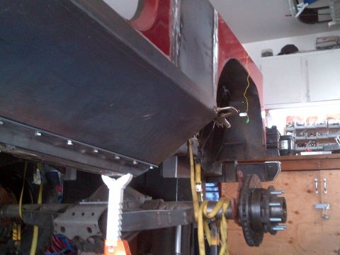 1985 Jeep CJ7 - Underside view of a 1985 Jeep CJ7 frame and body panel during restoration.