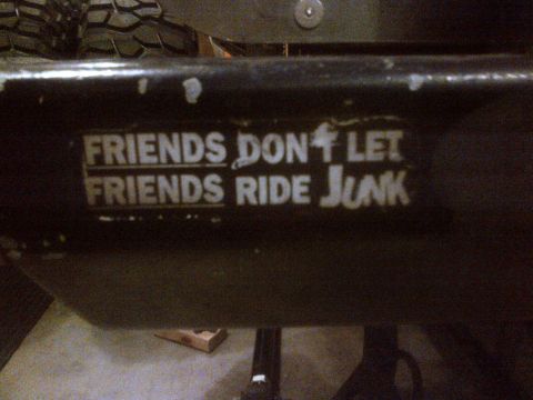 1985 Jeep CJ7 - A sticker on a vehicle part reads "Friends Don't Let Friends Ride Junk".
