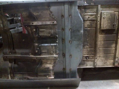 1985 Jeep CJ7 - Close-up view of the undercarriage of a Jeep CJ7 undergoing repair and fabrication.