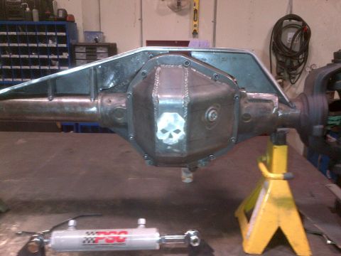 1985 Jeep CJ7 - Custom differential cover with skull design, likely for an off-road vehicle build.