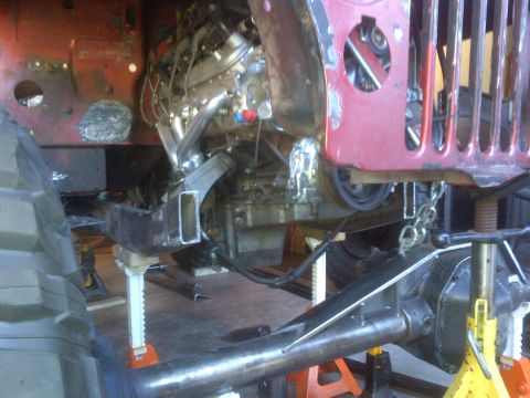 1985 Jeep CJ7 - This Jeep CJ is undergoing significant mechanical work, with the engine and suspension being addressed.