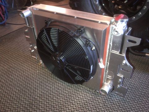 1985 Jeep CJ7 - Close-up of an aftermarket radiator assembly with an integrated electric cooling fan.